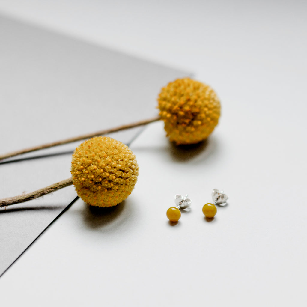 Pin earrings in mustard